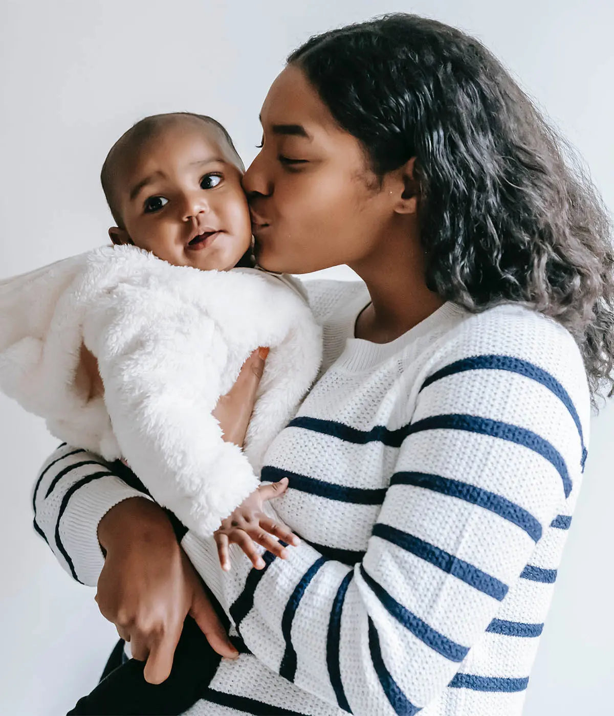 Mom and baby cuddling photo by William Fortunato with Pexels