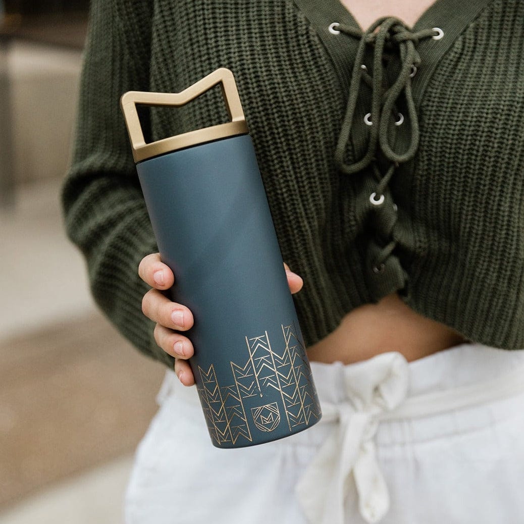 Mother holding Mila's Keeper Insulated Breast Milk Cooler in Starry Night