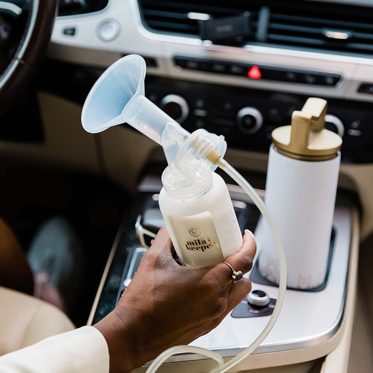 Mila's Keeper Insulated Breast Milk Cooler used for pumping in car.