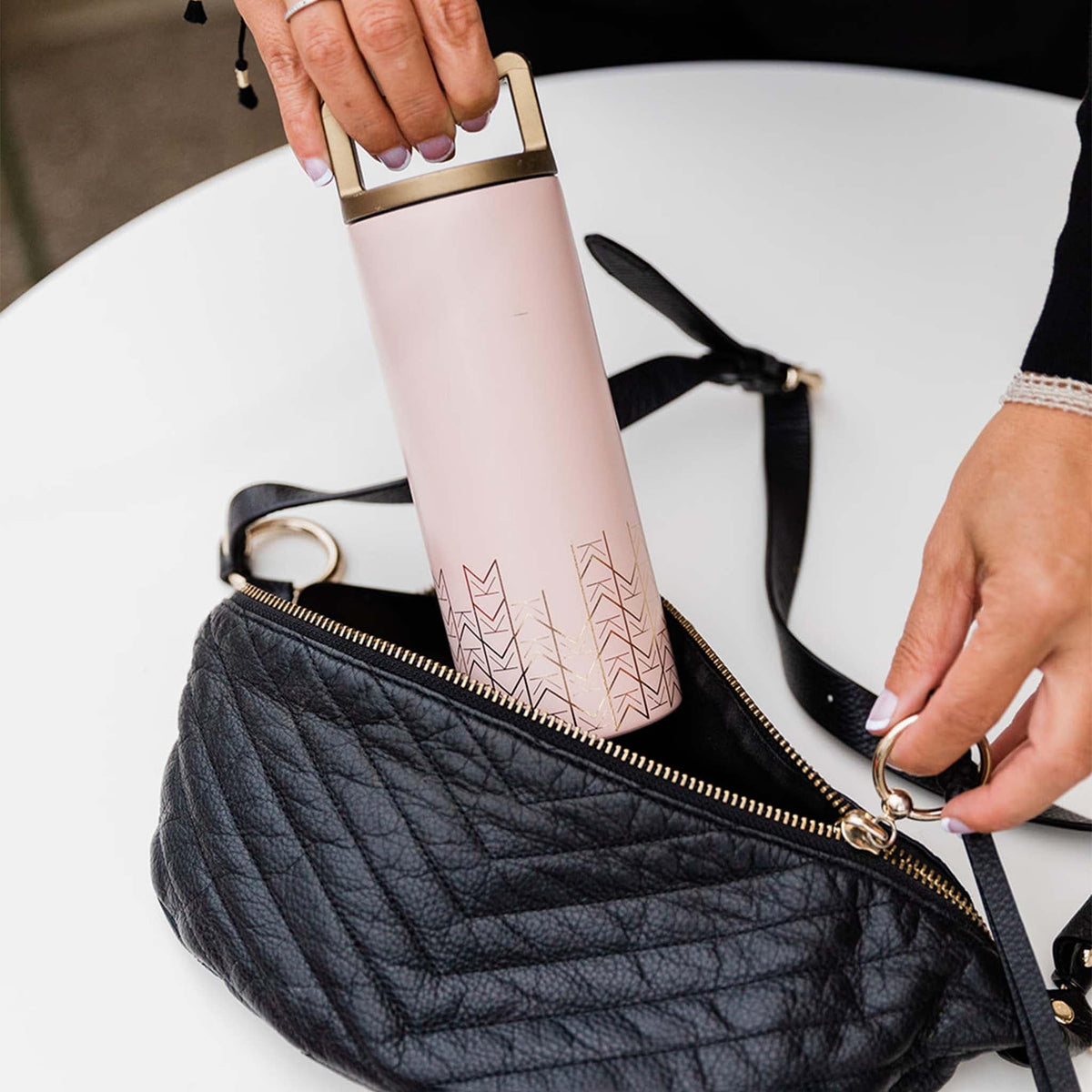 Mila's Keeper Portable Insulated Breast Milk Cooler fits easily inside small body purse.