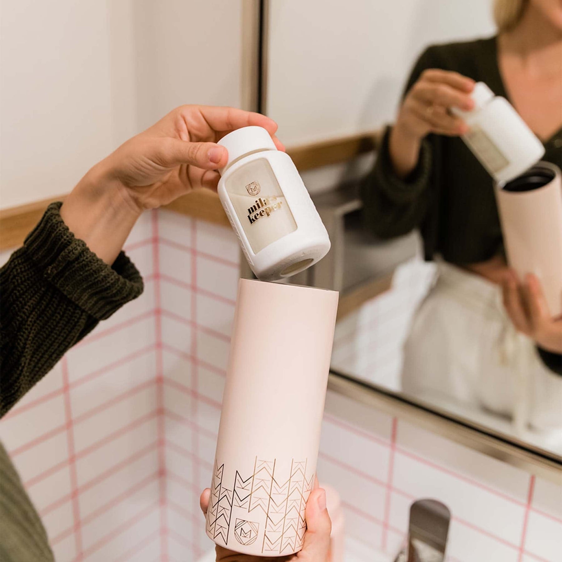 Mila's Keeper Breast Milk Cooler and Glass Breast Milk Storage pumping in bathroom.