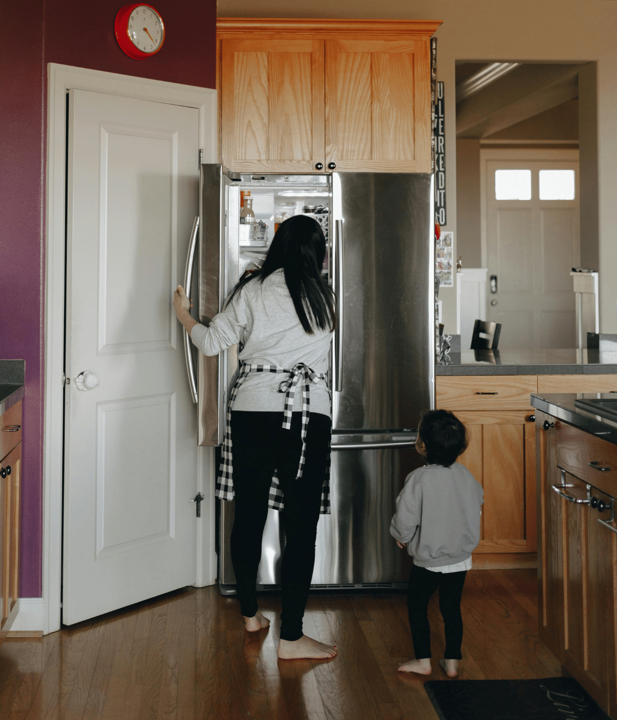 mom at fridge- Keeping breast pump parts in the fridge