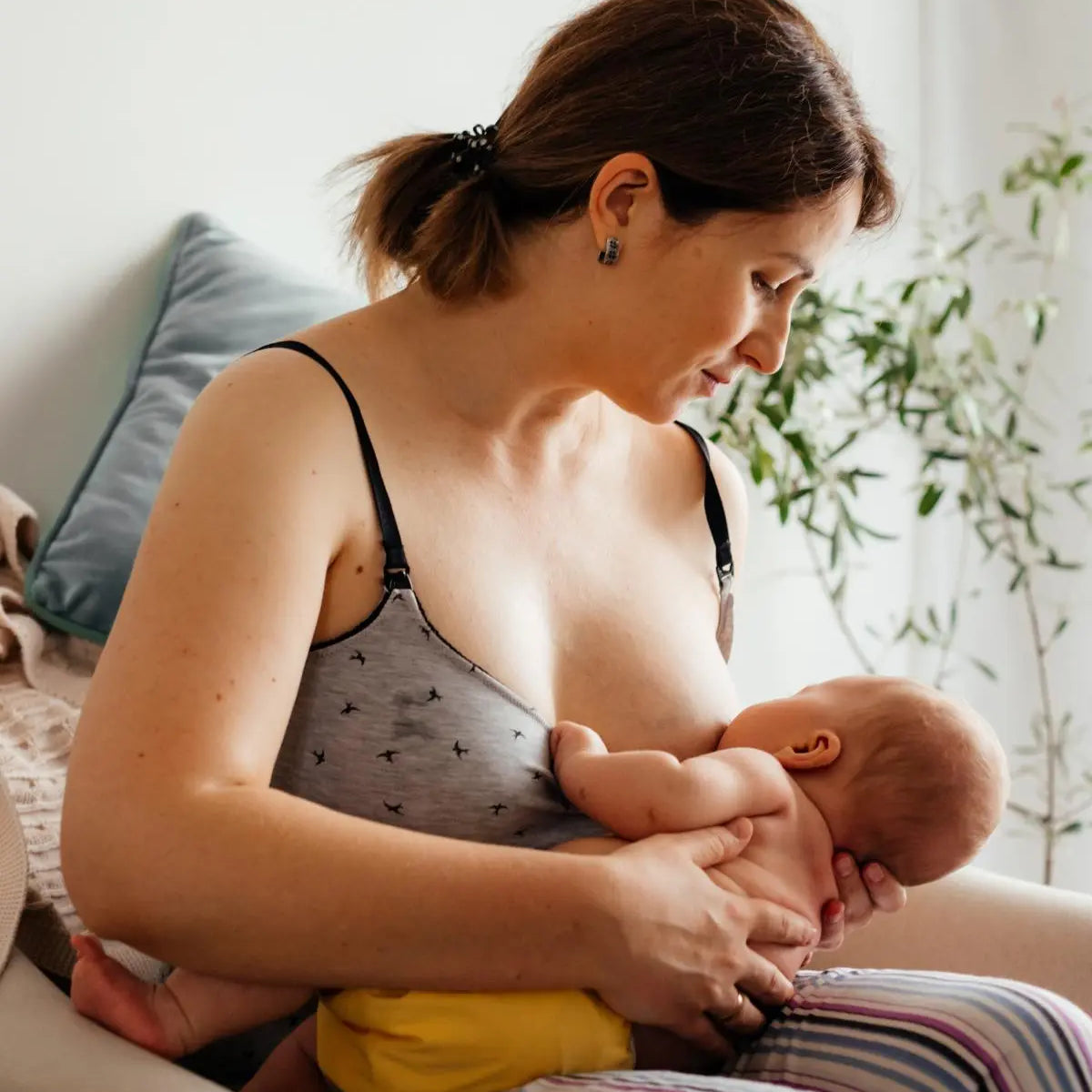 How to Breastfeed with large breasts: Breastfeeding Football Hold