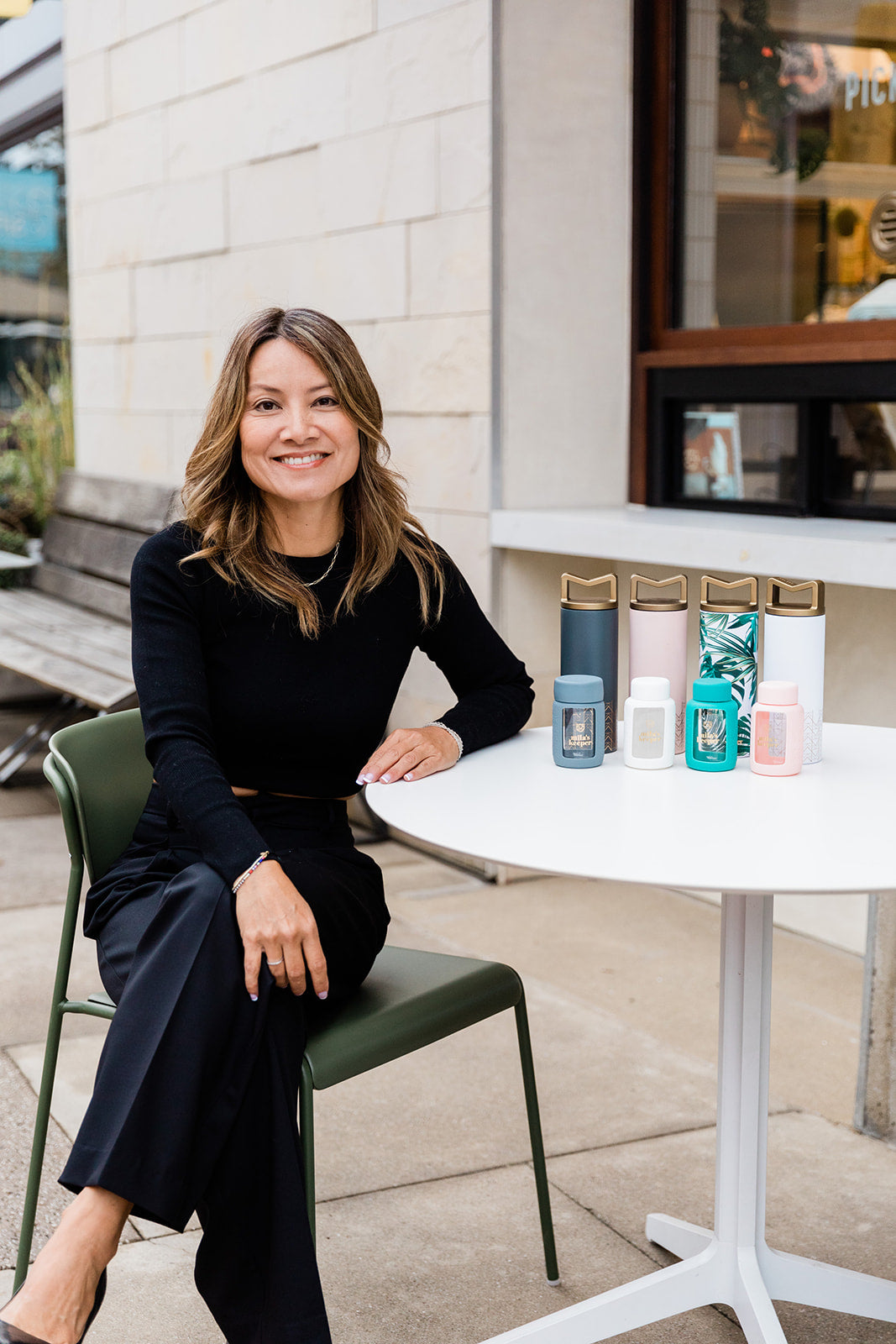 Mila's Keeper Founder Lara Vu sitting with first launch products