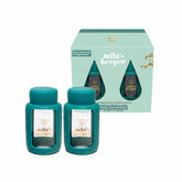 Two green Mila's Keeper glass breastmilk storage containers for pumping storing and feeding, fits Medela pumps and other leading brands.