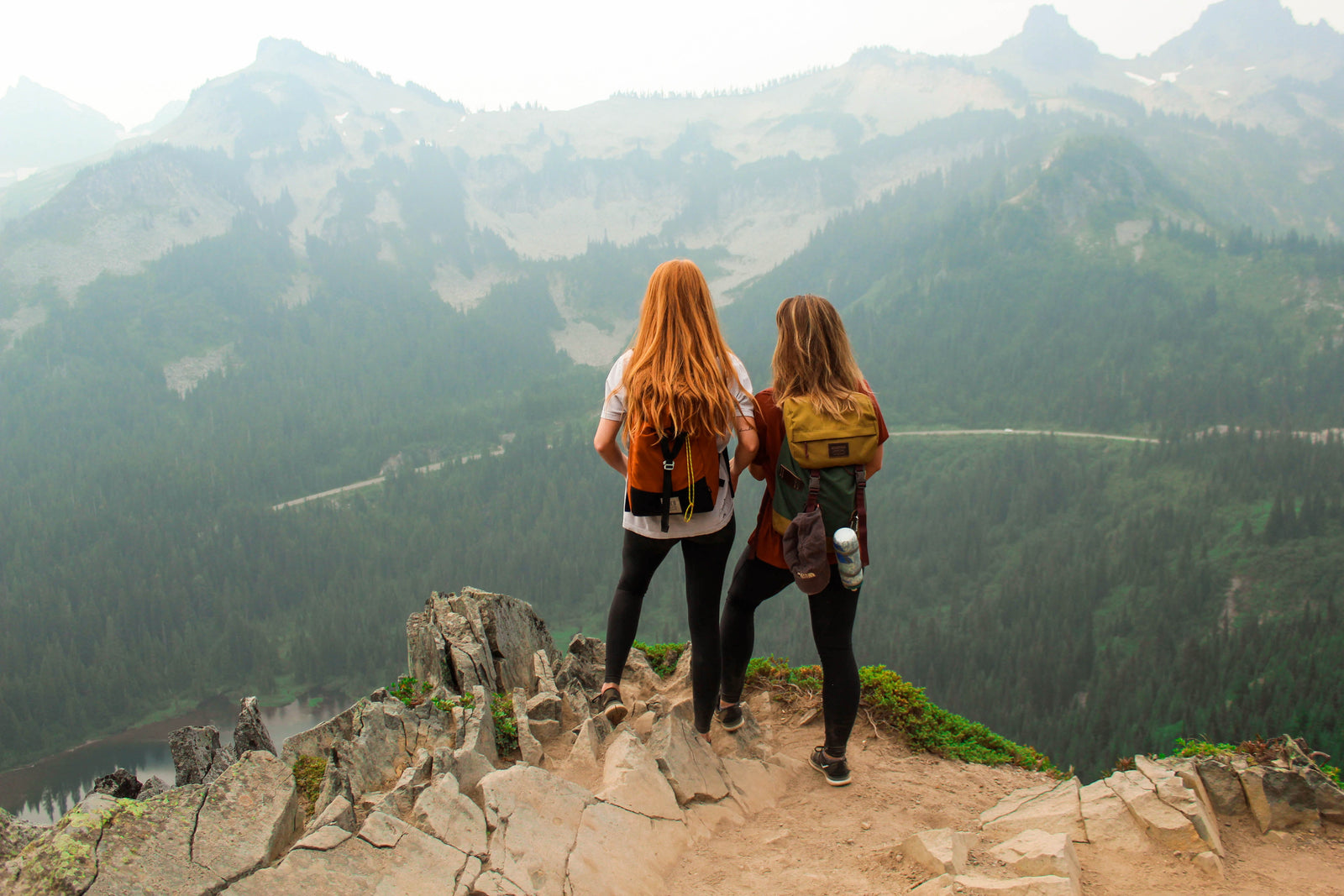 Two girls on mountaintop - by Kalisa Veer with Unsplash