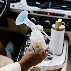 Mila's Keeper Breast Milk Storage Bottle with Pump in car